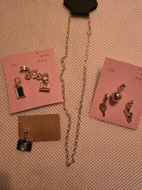 Create your own necklace, 7 charms & chain included. Very  cute & unique